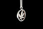 Silver pendant with a cannabis leaf design on a black background